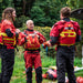 Rescue team wearing WRS Rescue Wrap PFDs showing front, back and right side