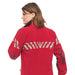 Female model wearing Courant Ark Softshell Jacket in Red showing the back of the jacket