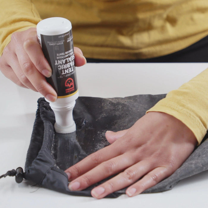 Hand model using Gear Aid Seam Grip Tent Fabric Sealant to Waterproof 