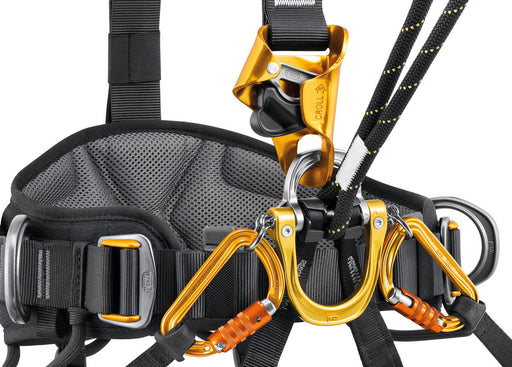 Close up of Petzl Astro Sit Fast Harness showing how the gated ventral attachment point allows you to efficiently integrate equipment (such as rope clamp, lanyard, or seat).