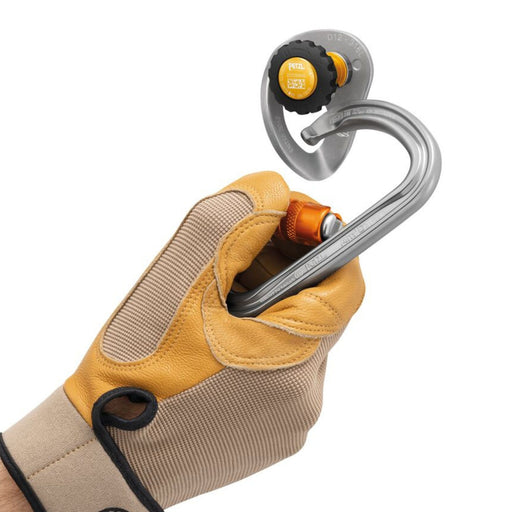 Hand model wearing a glove using the Petzl Coeur Pulse Anchor highlighting the COEUR hanger large opening, making it easy to clip and allowing two carabiners to be installed simultaneously.