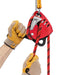 Professional demonstrating Petzl Maestro Red L Descender ergonomic handle and
integrated brake which allows for
comfortably controlled descent.