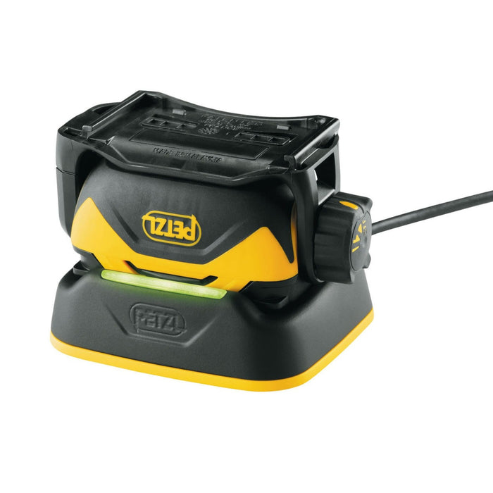 Charging dock for directly charging the Petzl Pixa 3R Head Torch Light without removing the battery. The battery may also be charged alone to allow the user to continue using the headlamp with a second battery.