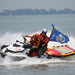 Two rescue responders on a jet ski towing a WRS Rapid D rescue board