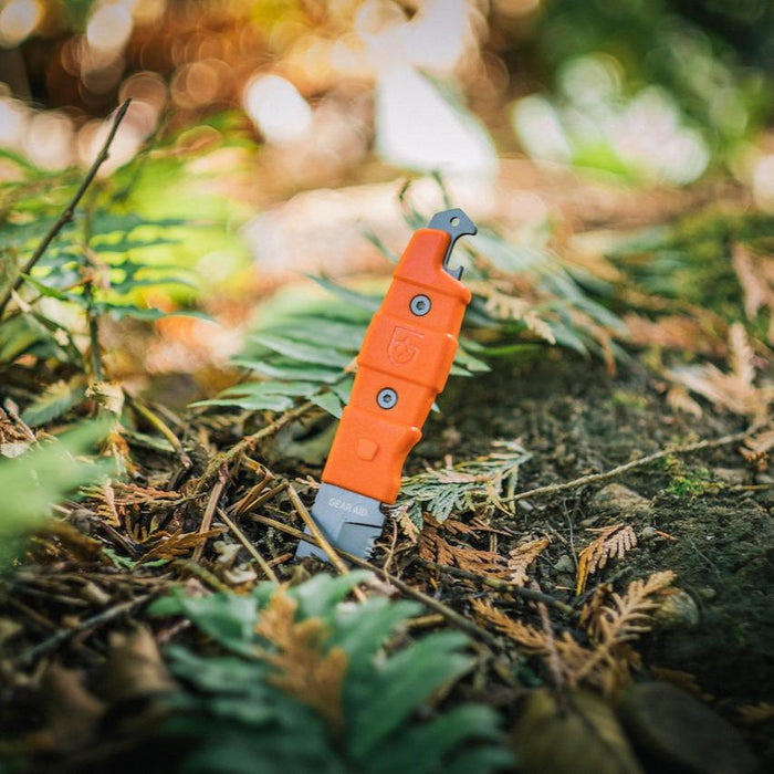 Gear Aid Buri Knife with Orange Handle  Outside in the woods 